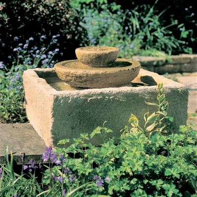 Installez la fontaine imitation bois de Jardin et Saisons